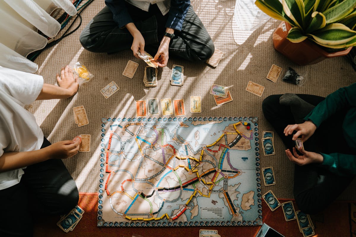 Kingdomino — players building their kingdom grids with domino landscape tiles